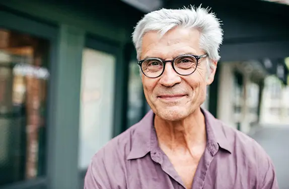 Mature male in-glasses smiling